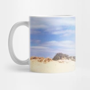 Red phone box on the beach Mug